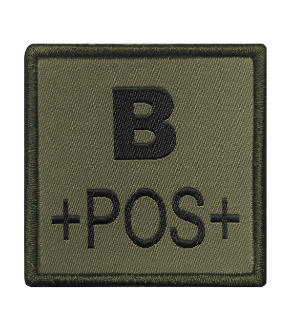 Groupe sanguin B positif brodé sur tissu vert olive
